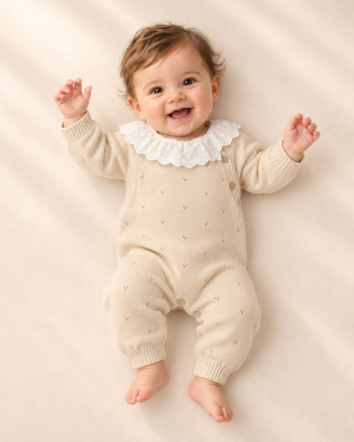Front view of the knit jumpsuit, layered with a yellow cardigan – Oatmeal