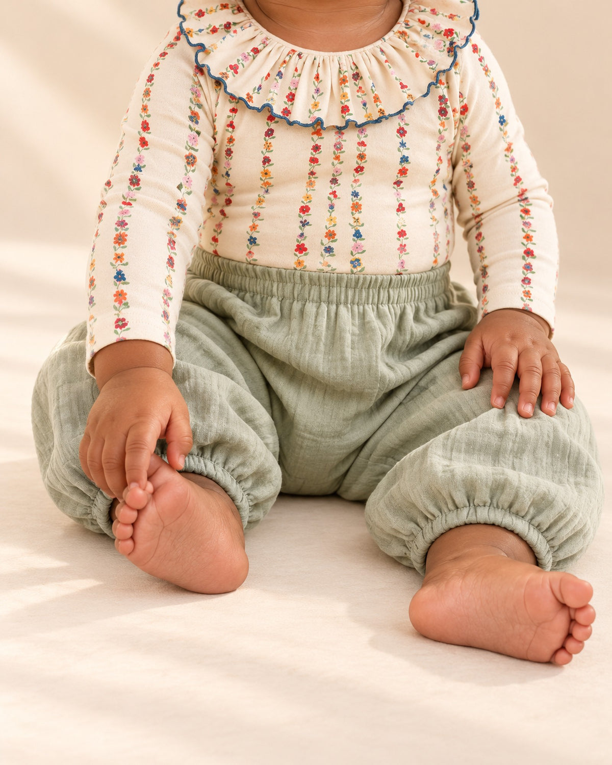 Sage green cotton muslin balloon pants with gathered elastic cuffs