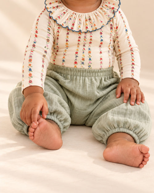 Sage green cotton muslin balloon pants with gathered elastic cuffs
