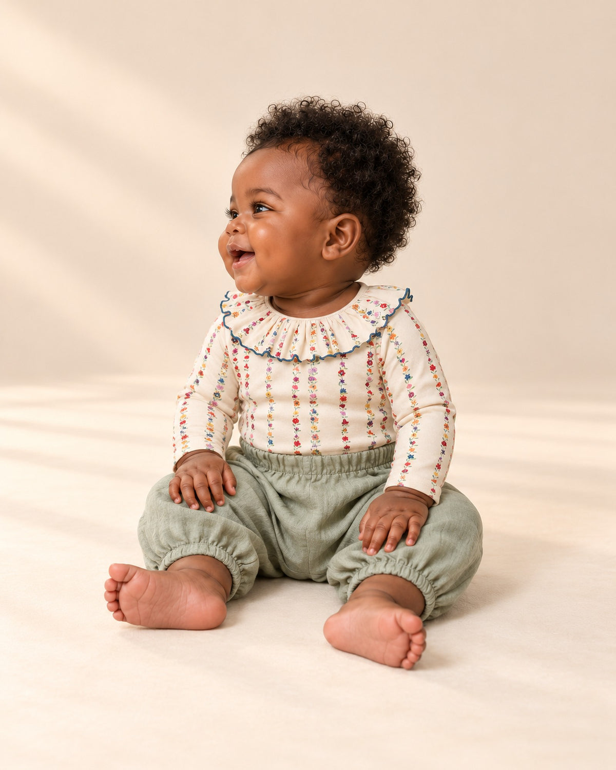 Side view of the sage muslin pants showing the full balloon leg and ankle cuff – Sage