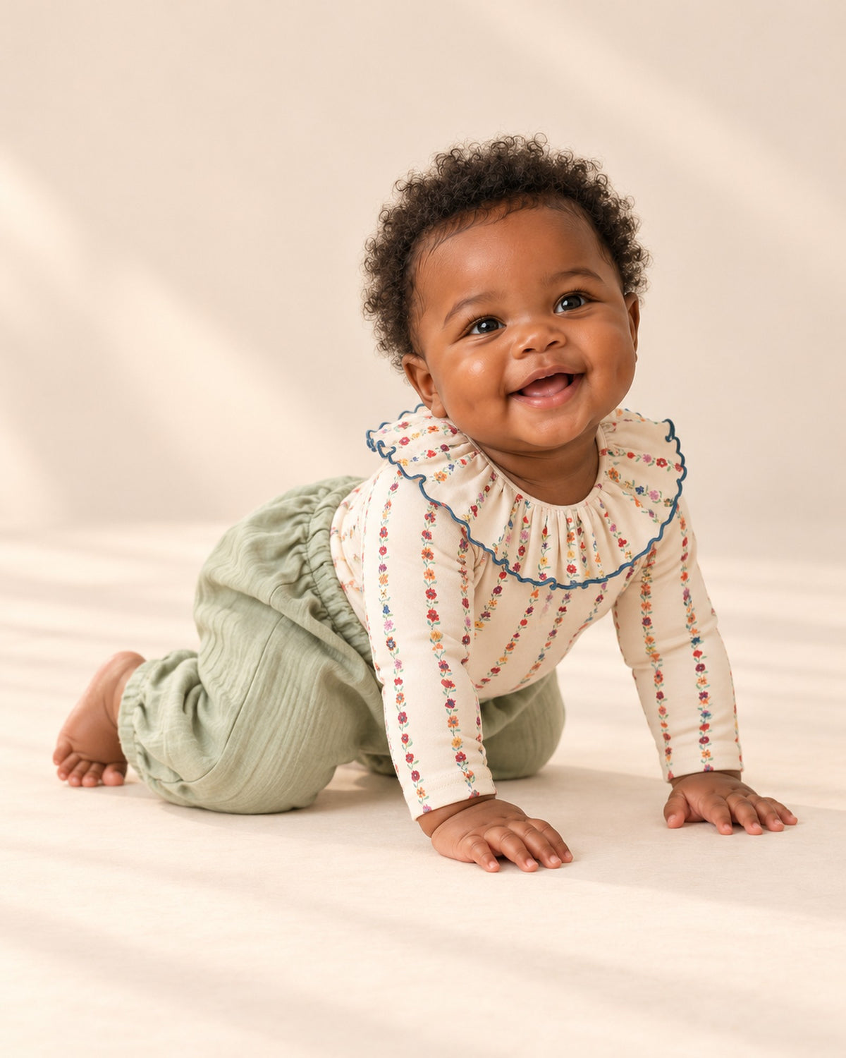 Baby in the sage balloon pants and ruffle collar bodysuit, head to toe – Sage