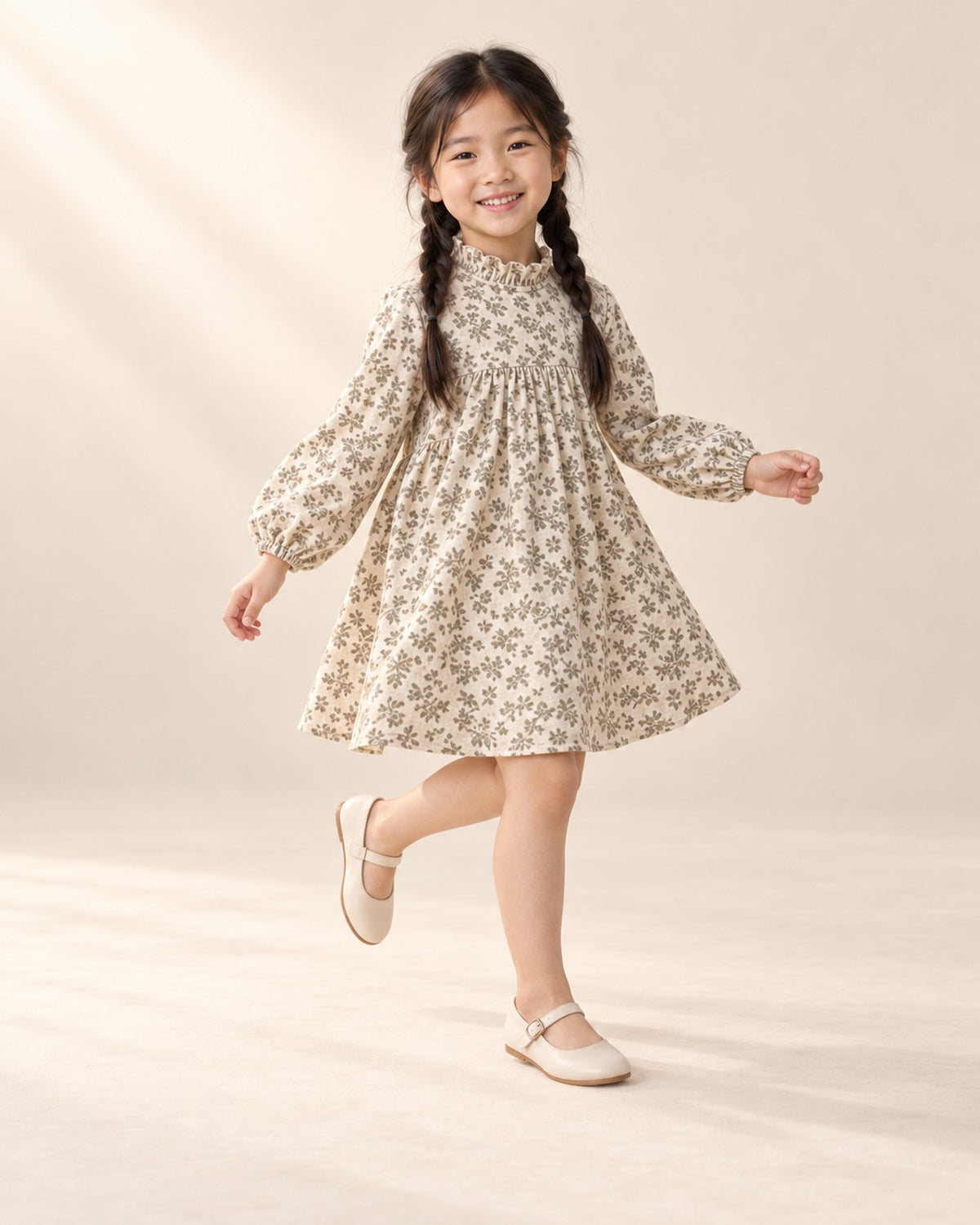 Girl skipping in the sage floral long-sleeve dress – Cream Floral