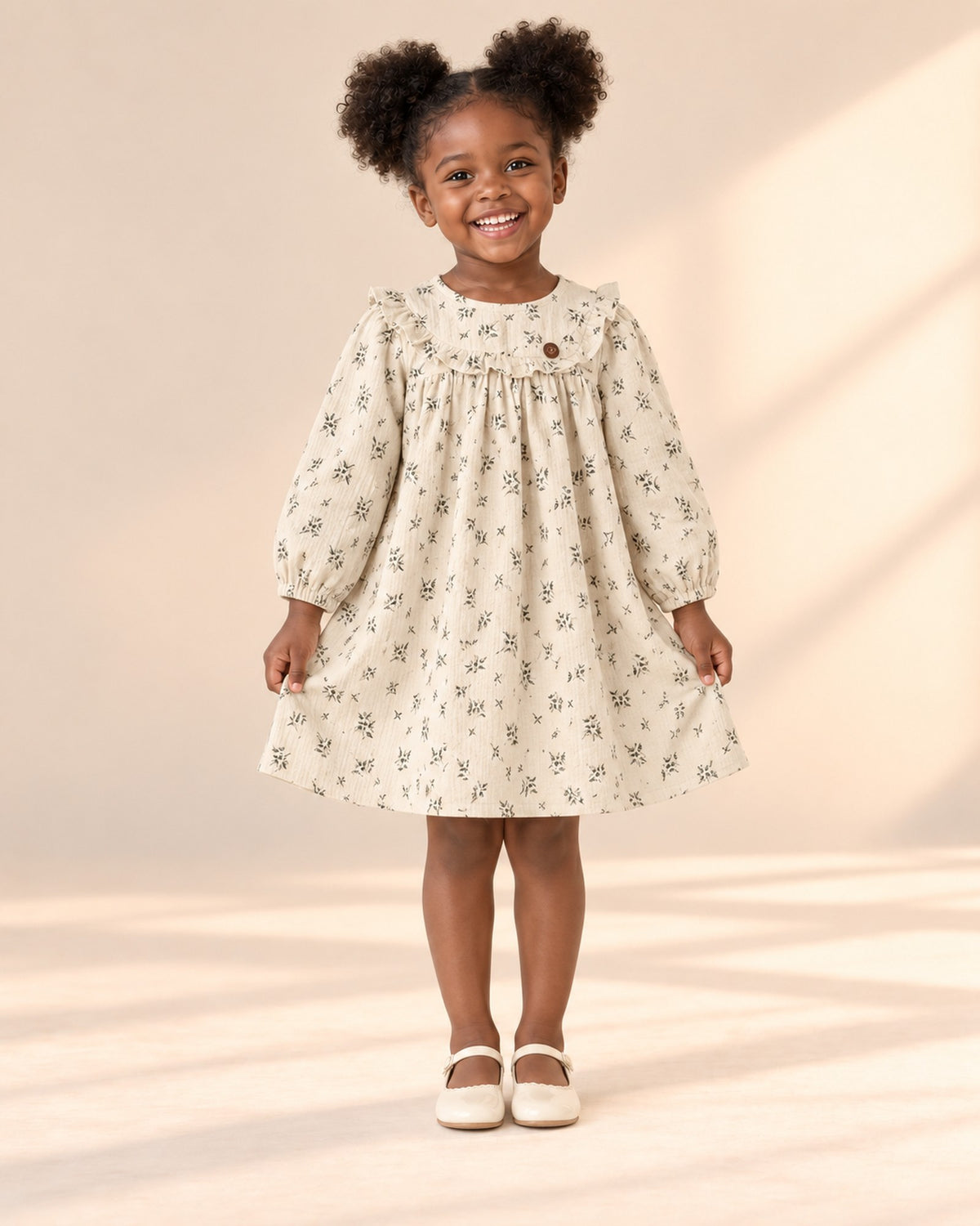 Front view of the leaf print dress with a ruffled yoke, full length – Cream