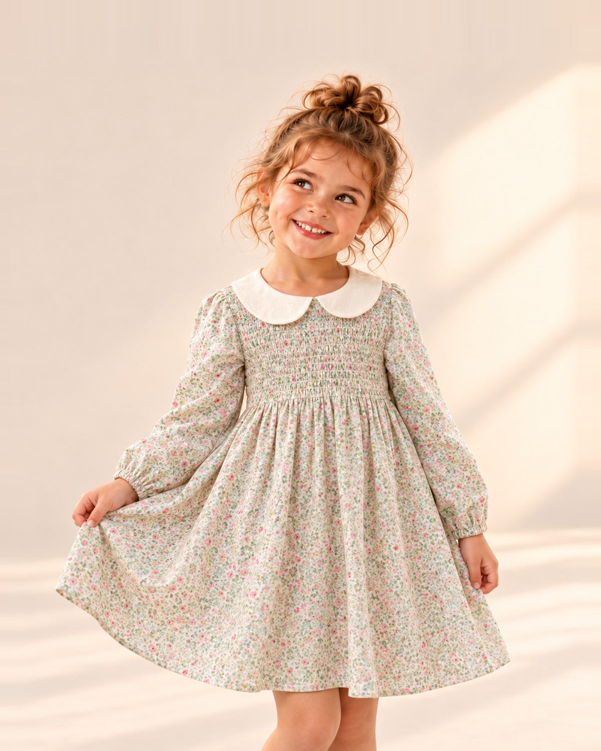 Girl holding out the skirt of the Violet sage floral smocked dress – Sage Floral