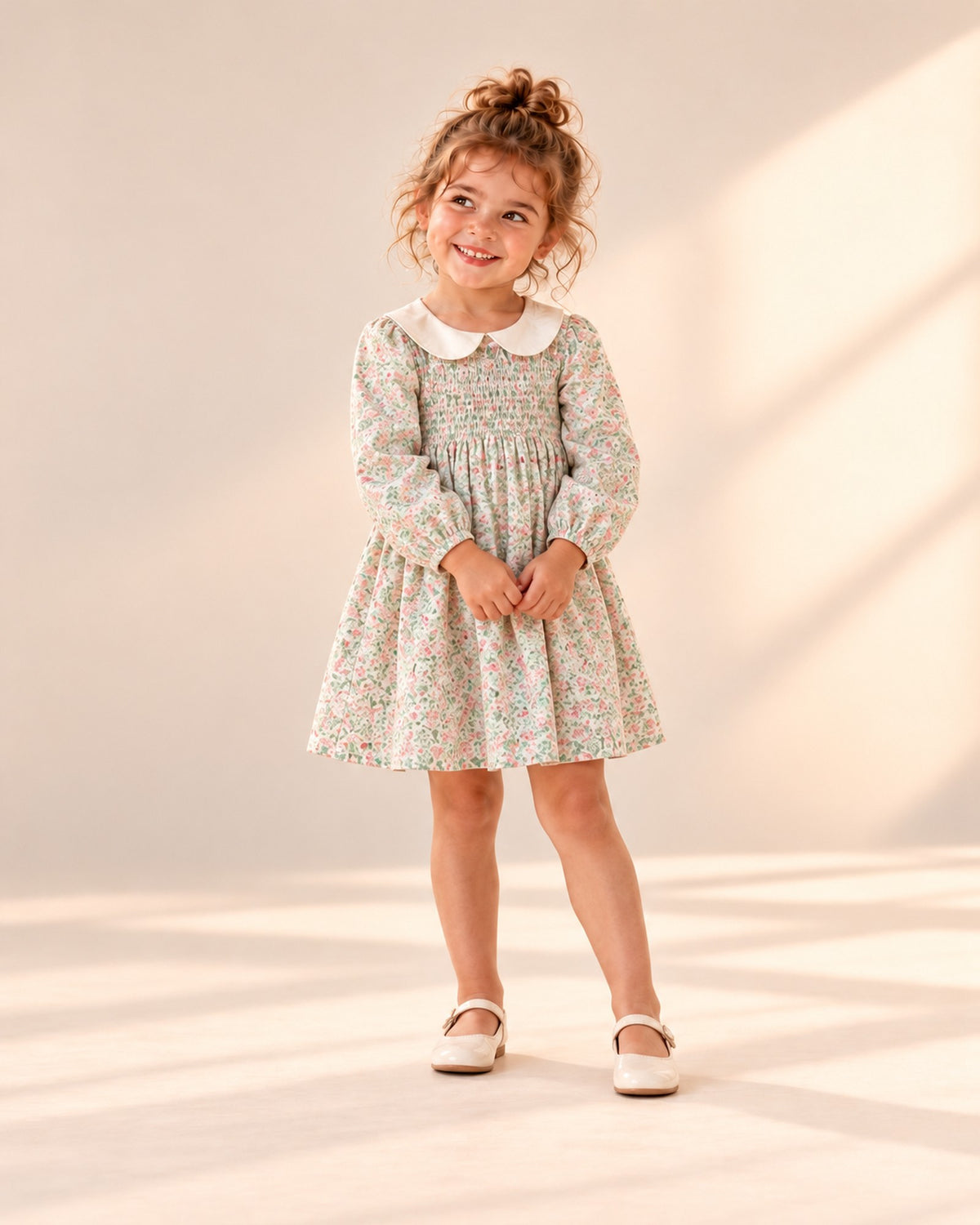 Front view of the smocked dress with a cream Peter Pan collar, full length – Sage Floral