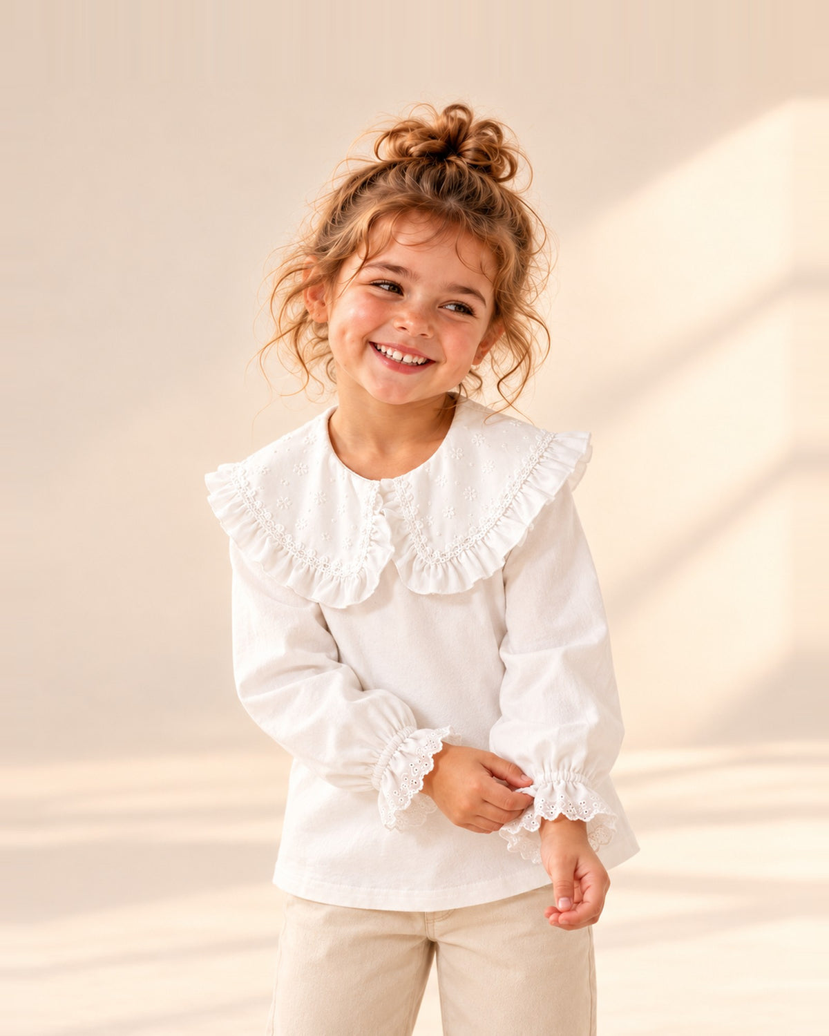 Girl in the Hazel white blouse with a big ruffled collar – White