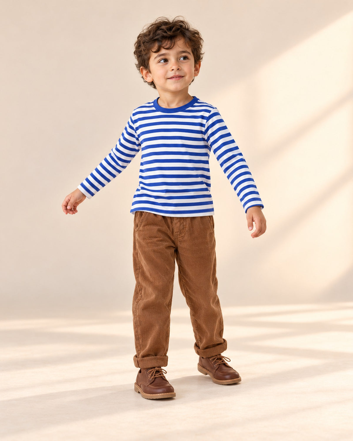 Boy at play in the long-sleeve striped tee, styled with the corduroy pull-on pants – Blue Stripe