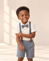 Boy in the Henry suspender set with an ivory shirt and gray bow tie – Ivory & Grey