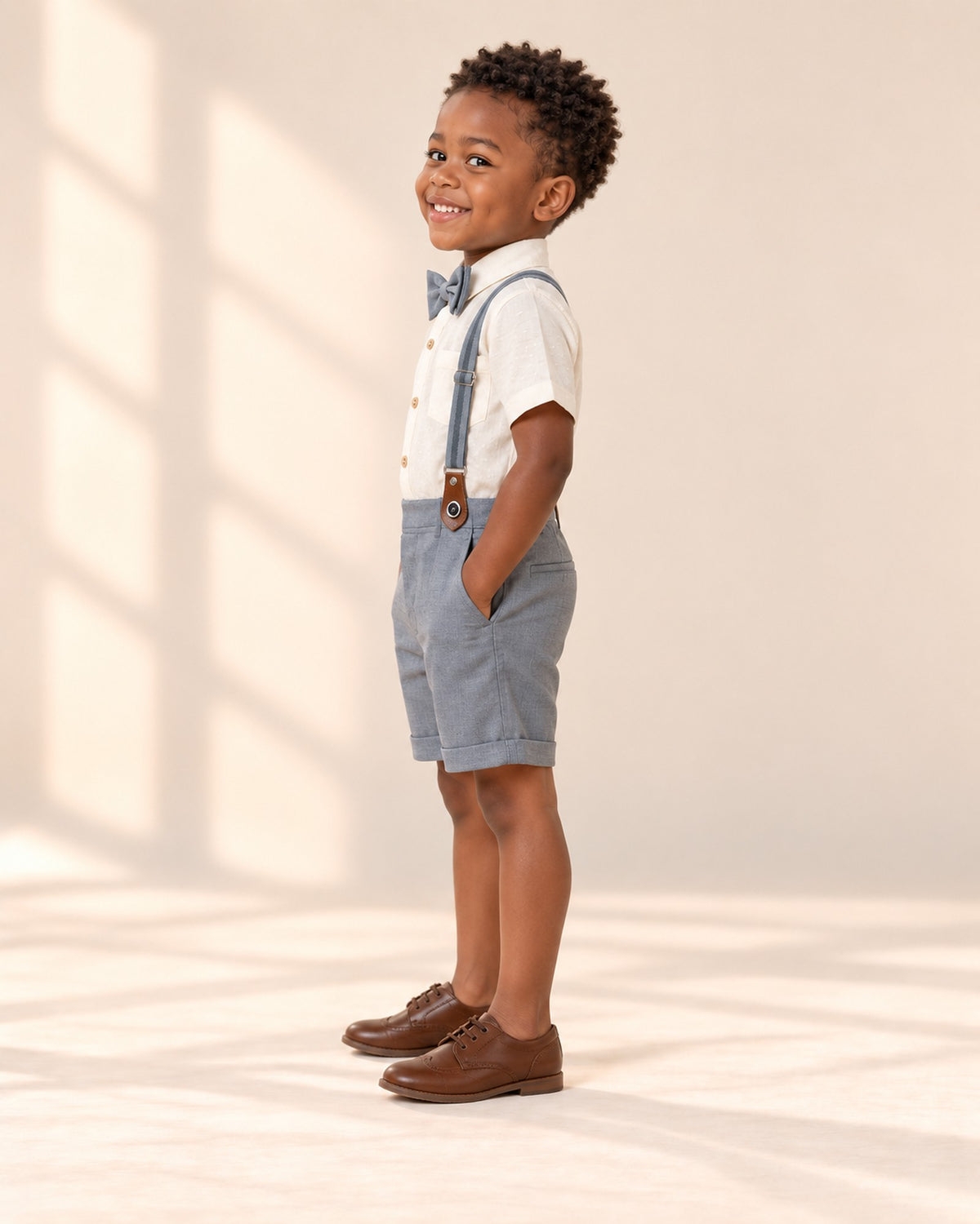Side view showing the rolled-cuff shorts – Ivory & Grey