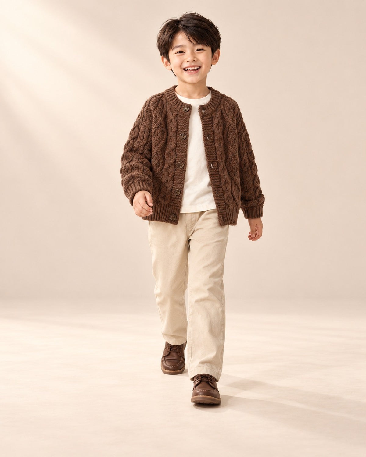 Oscar Chunky Cable Cardigan in Chocolate – natural pose