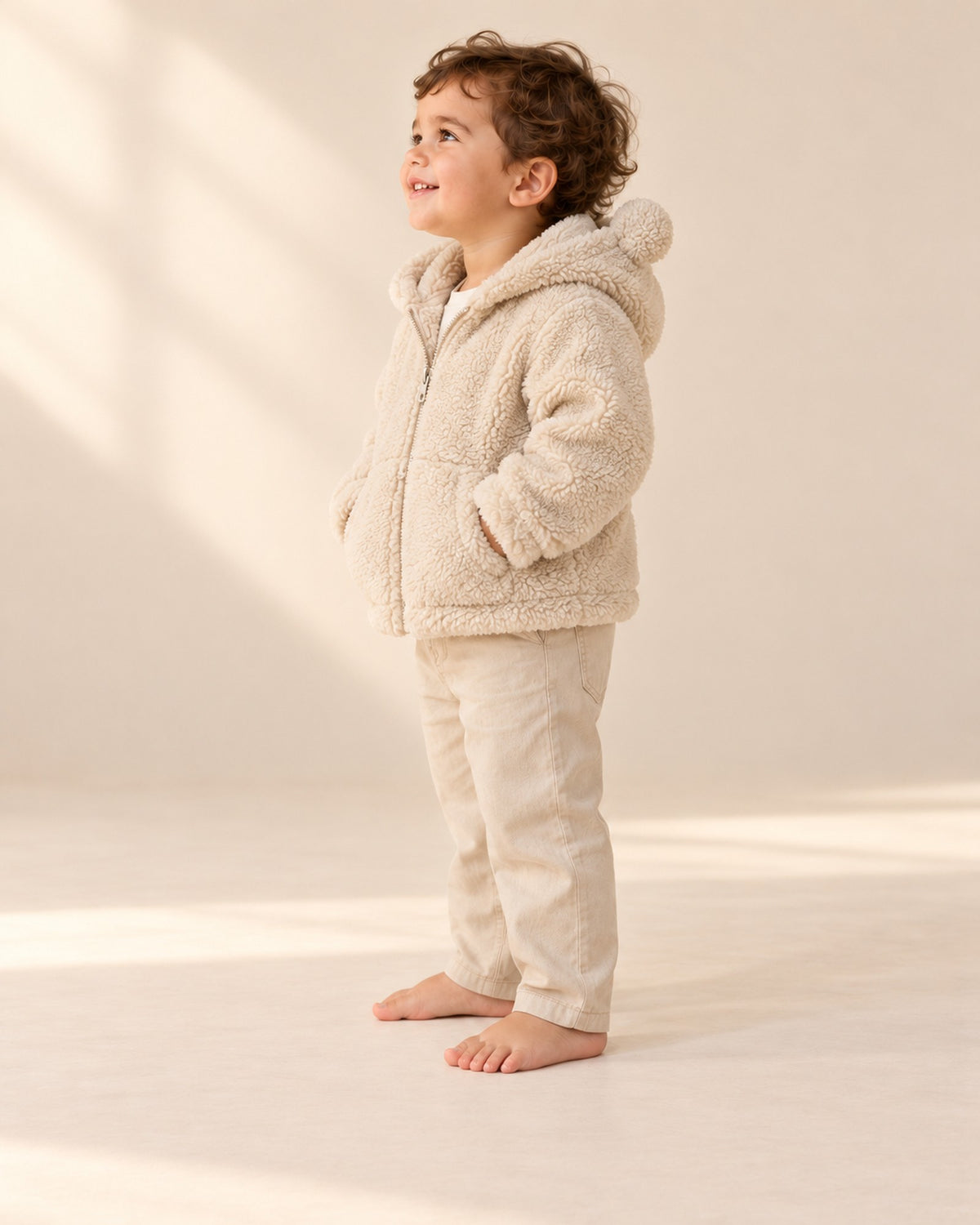 Side view of the sherpa jacket with hood and bear ears – Cream