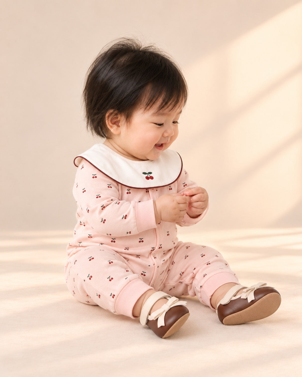 Side view of the brown bow pre-walker with the cherry romper – Brown