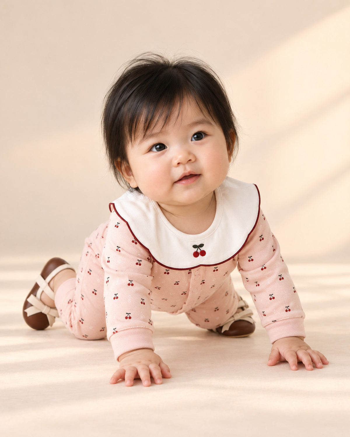 Baby in the cherry romper and bow pre-walkers, head to toe – Brown