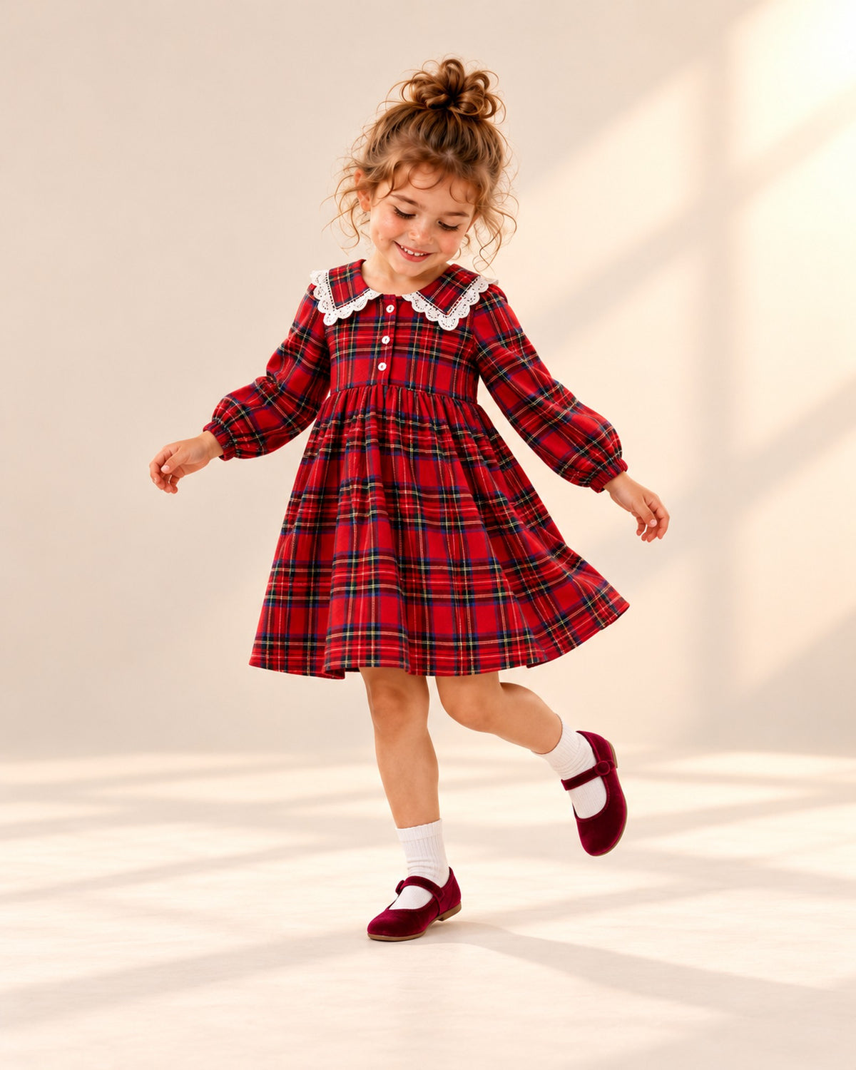 Girl twirling in the tartan dress and burgundy Mary Janes – Burgundy
