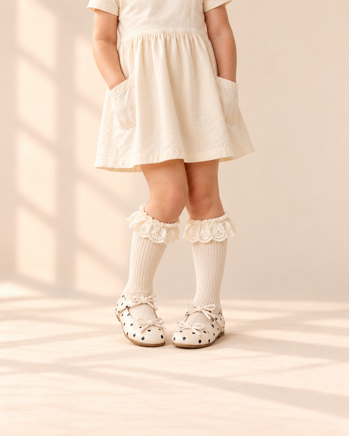 Cream ribbed socks with wide eyelet lace ruffles