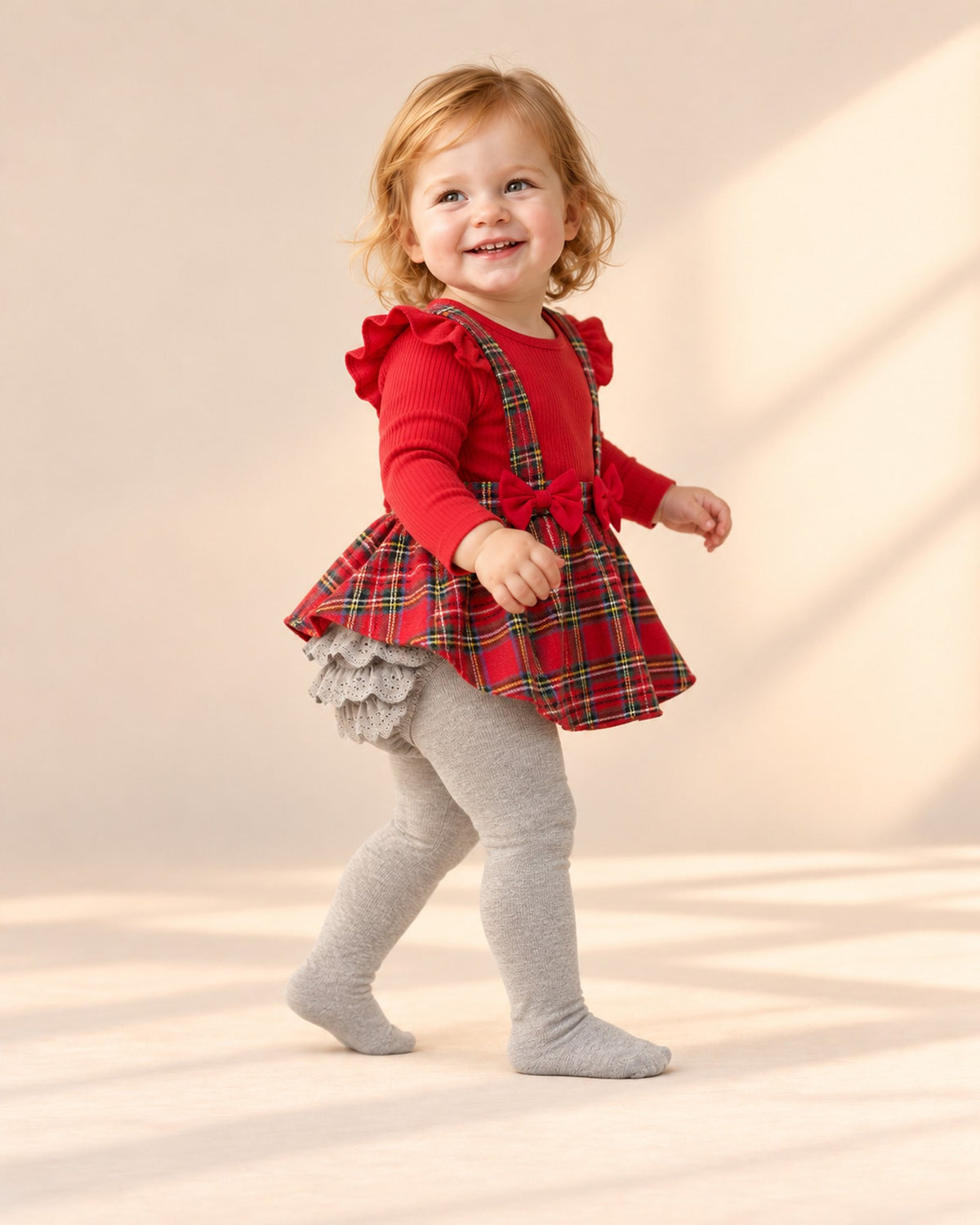 Toddler walking away with the grey lace ruffles showing – Grey