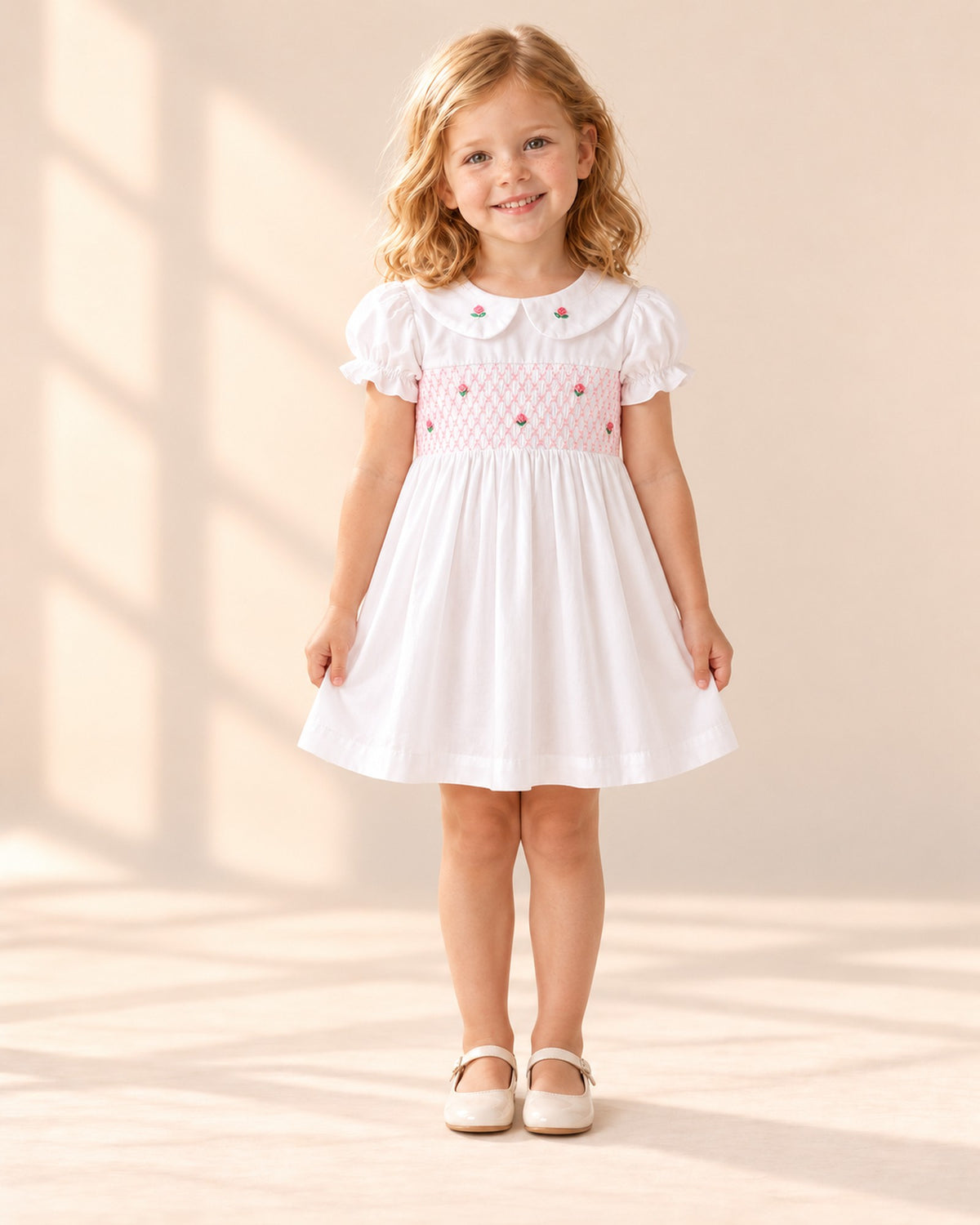 Front view of the white rosebud smock dress, full length – White