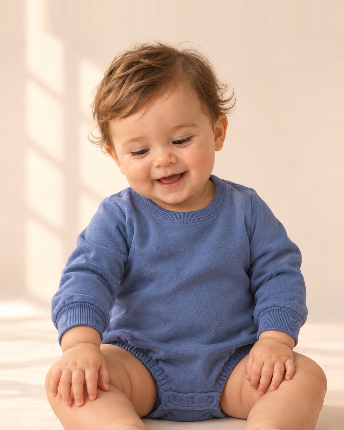 Baby sitting in the Gus dusty blue bubble romper – Dusty Blue