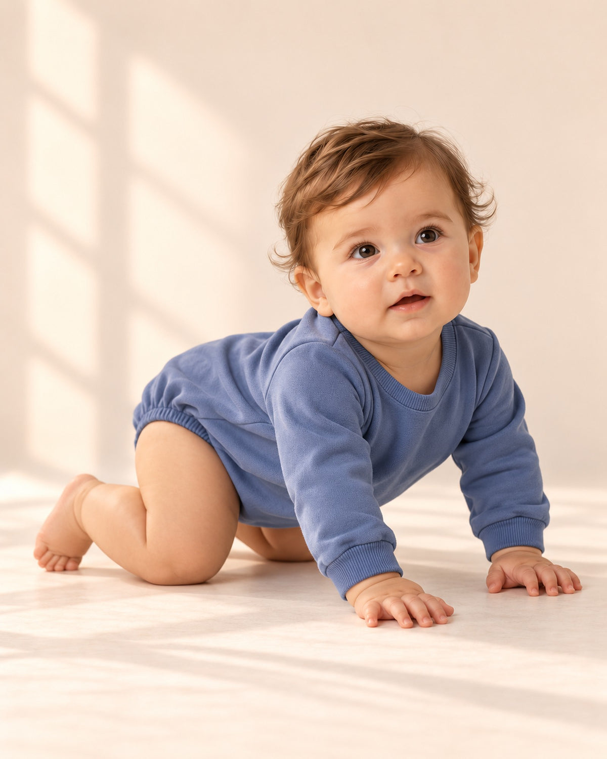 Baby crawling in the dusty blue sweatshirt bubble romper – Dusty Blue