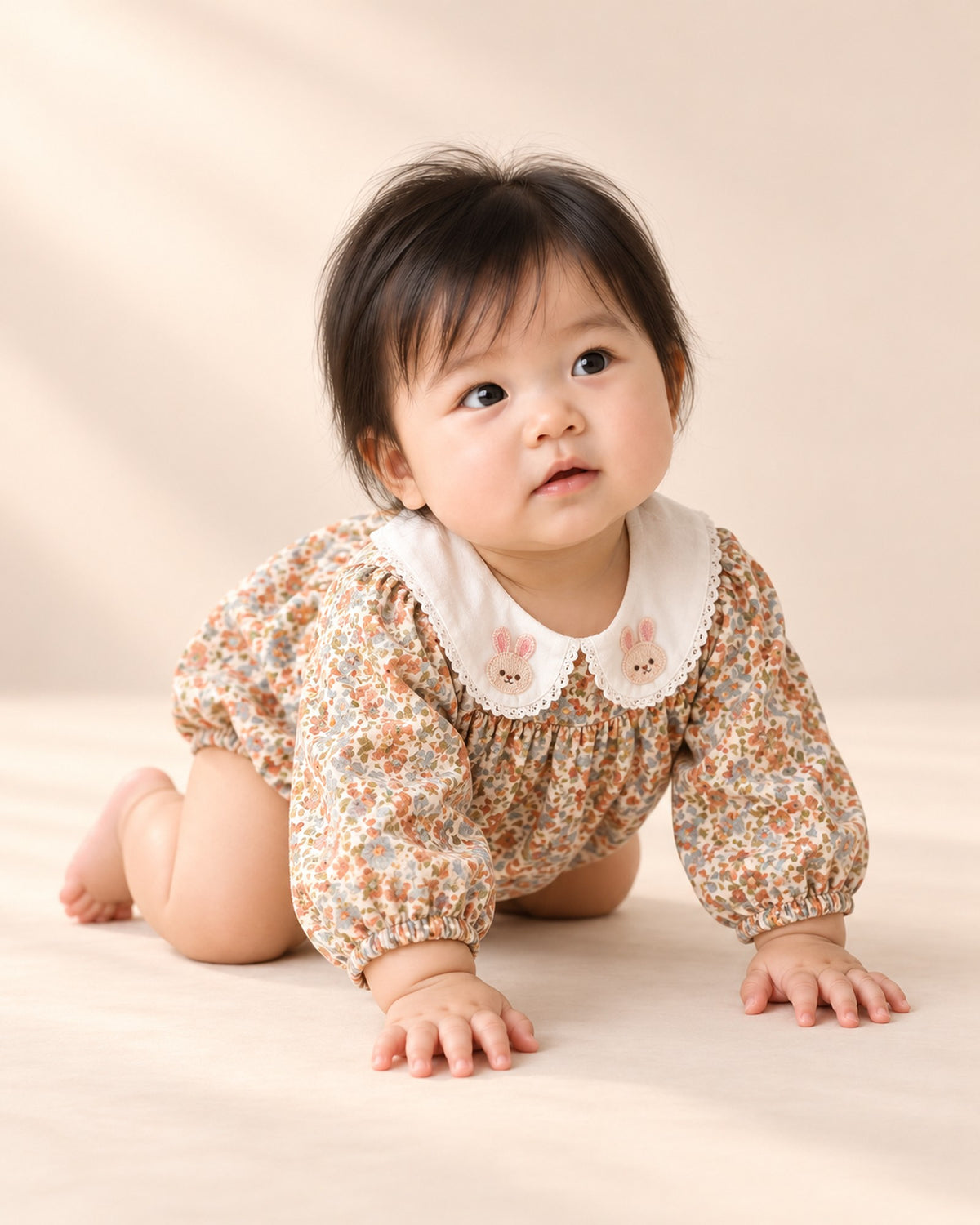 Baby crawling in the floral romper with embroidered bunny collar – Vintage Floral