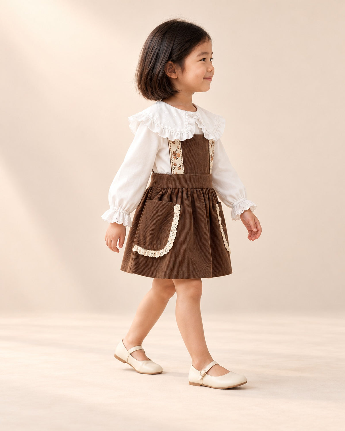 Sylvie Lace Pocket Corduroy Pinafore in Chocolate – side view