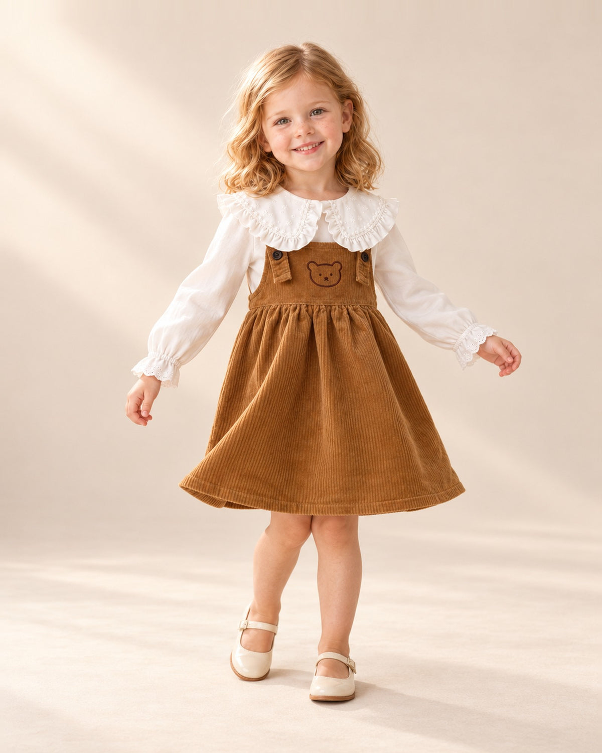 Betsy Teddy Corduroy Pinafore in Caramel – natural pose