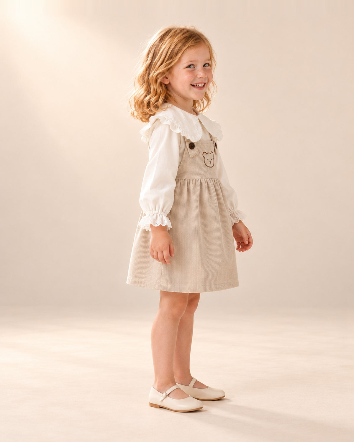 Betsy Teddy Corduroy Pinafore in Oatmeal – side view