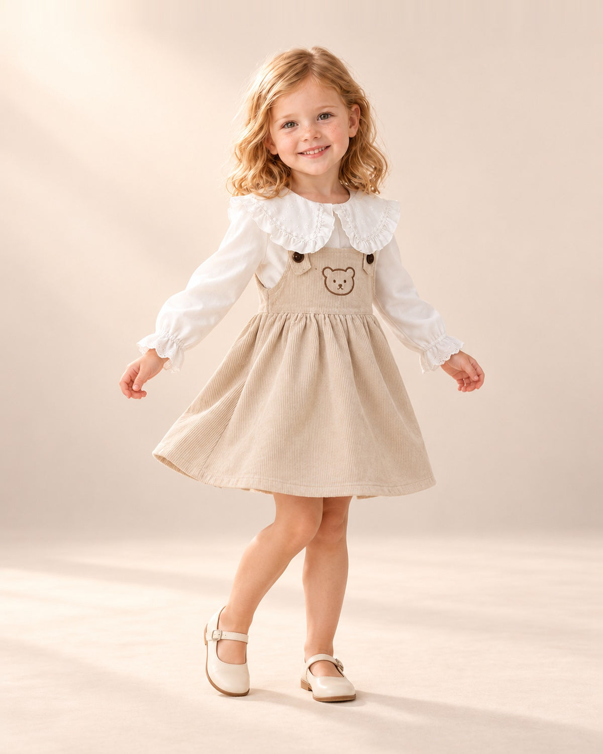 Betsy Teddy Corduroy Pinafore in Oatmeal – natural pose