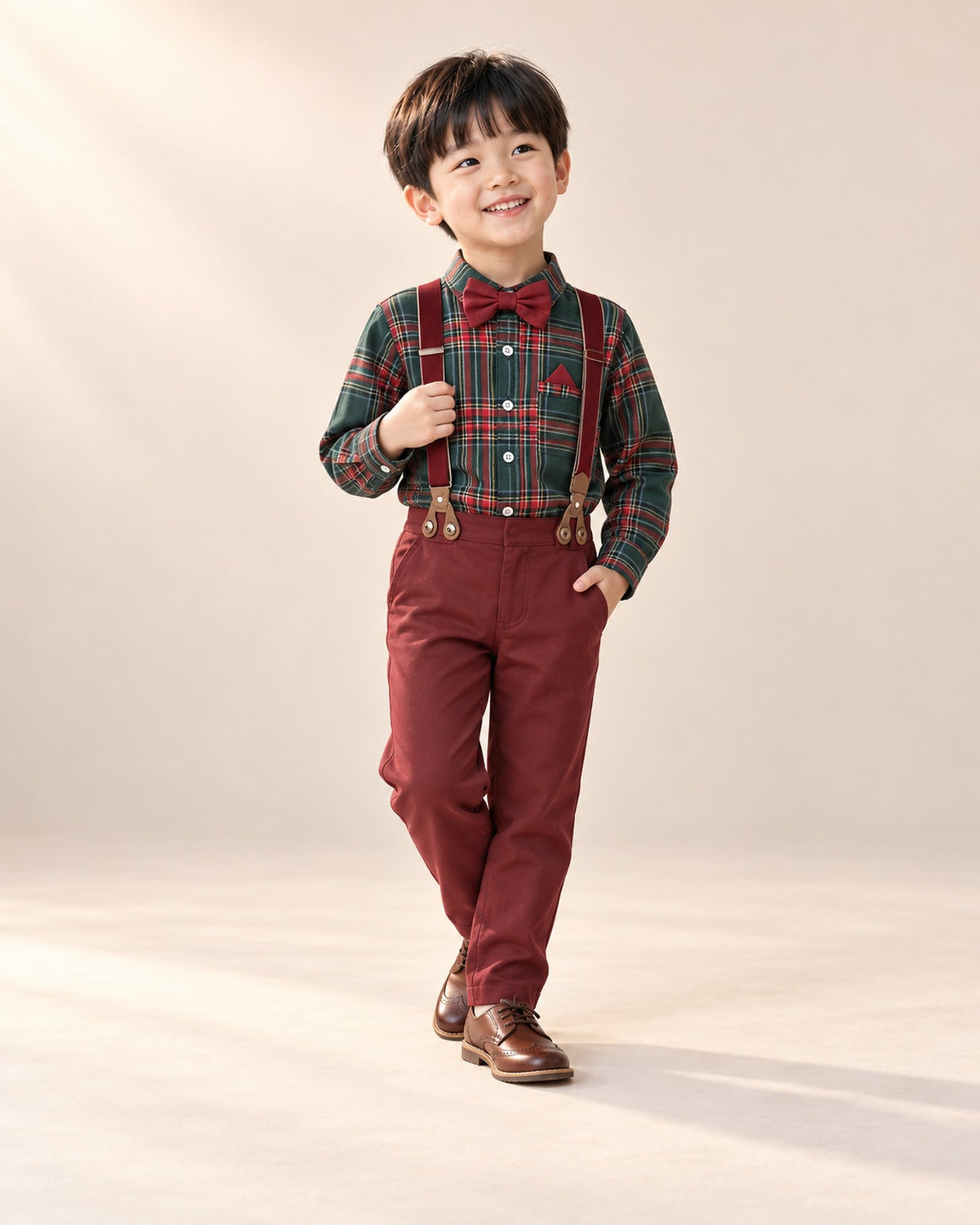 Boy smiling in the holiday tartan shirt and suspender set – Tartan
