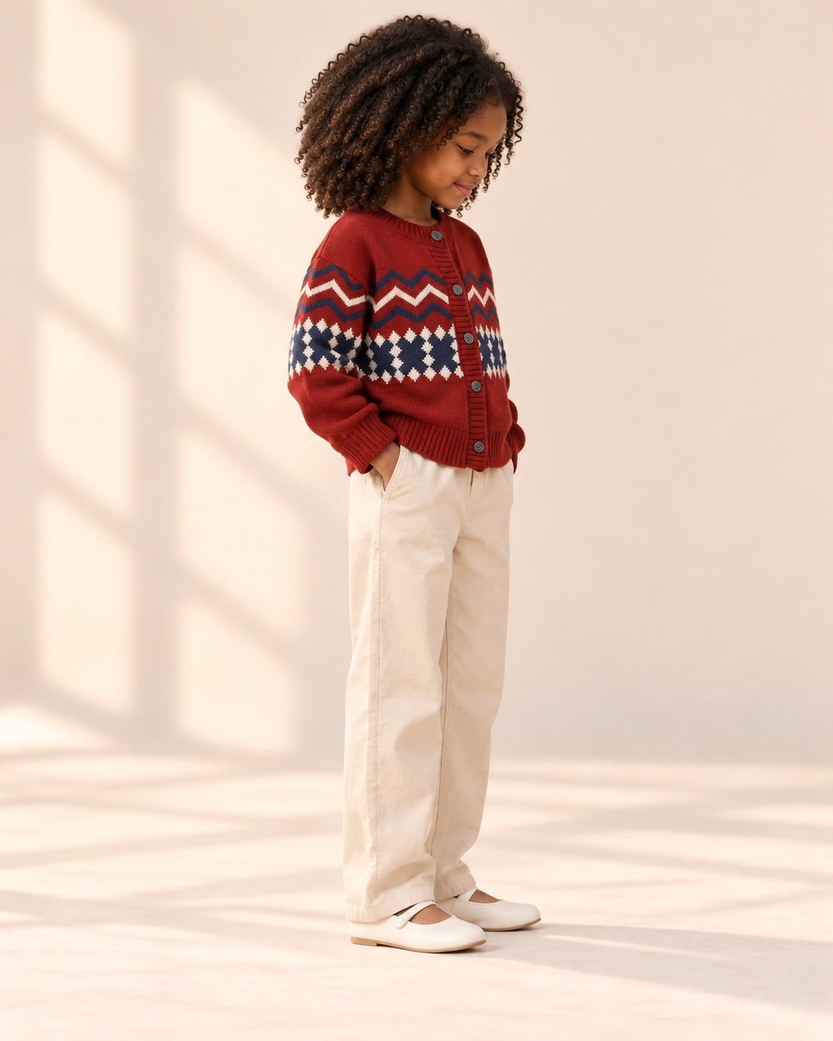 Side view of the cardigan showing the patterned sleeves – Red