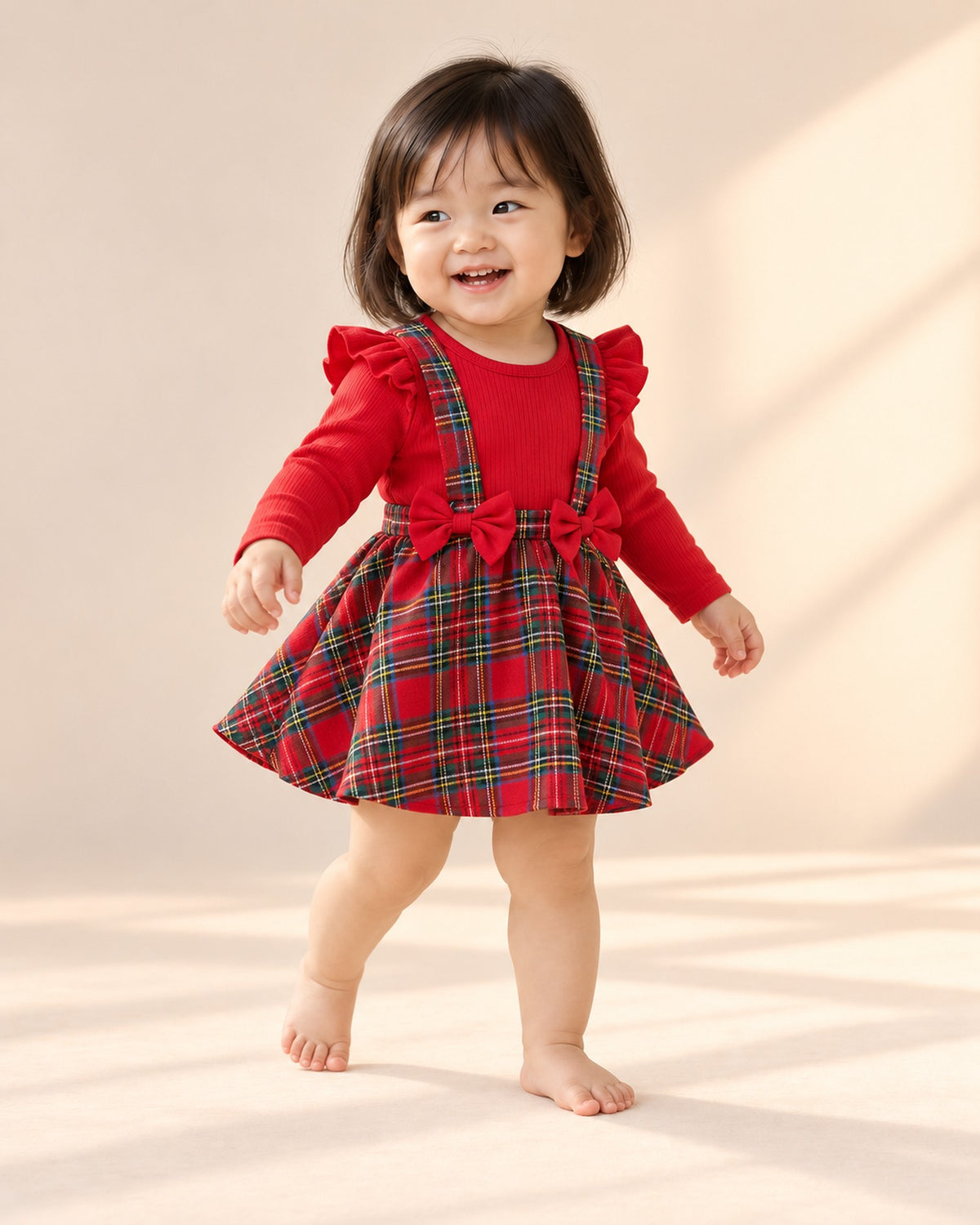 Toddler at play in the tartan bow romper dress – Red Tartan