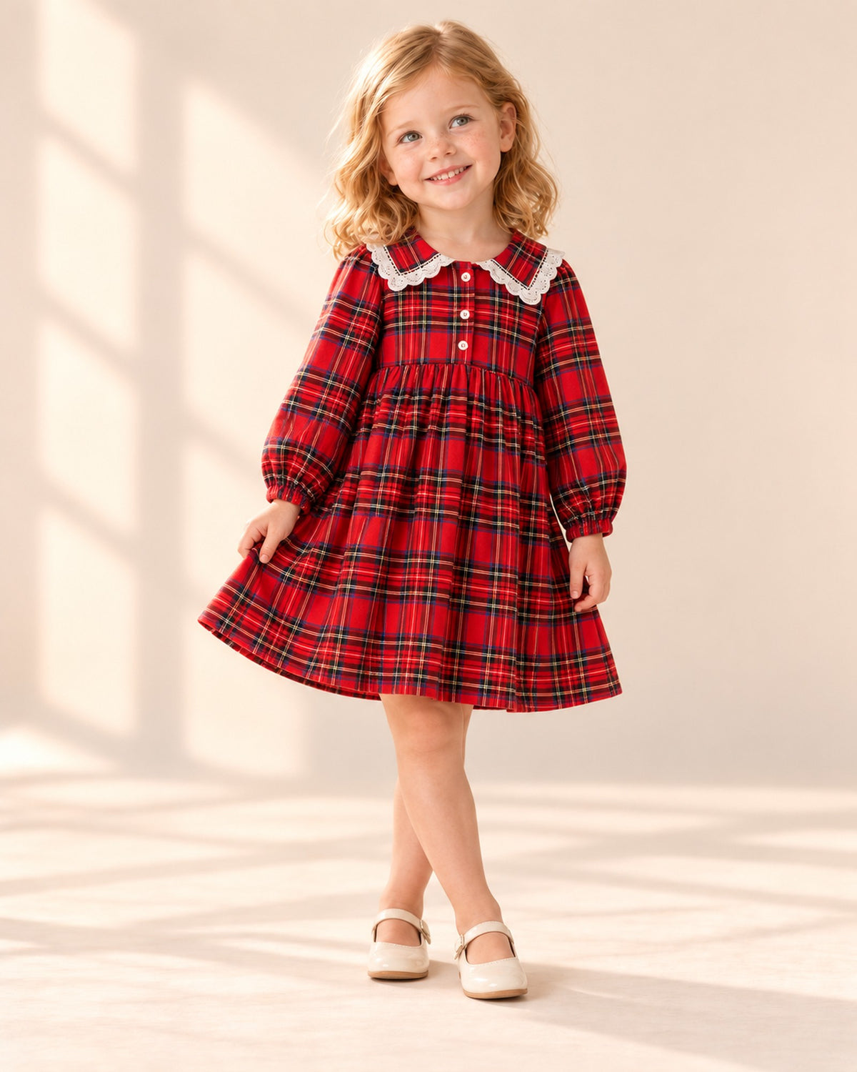 Girl holding out the skirt of the red tartan dress – Red Tartan