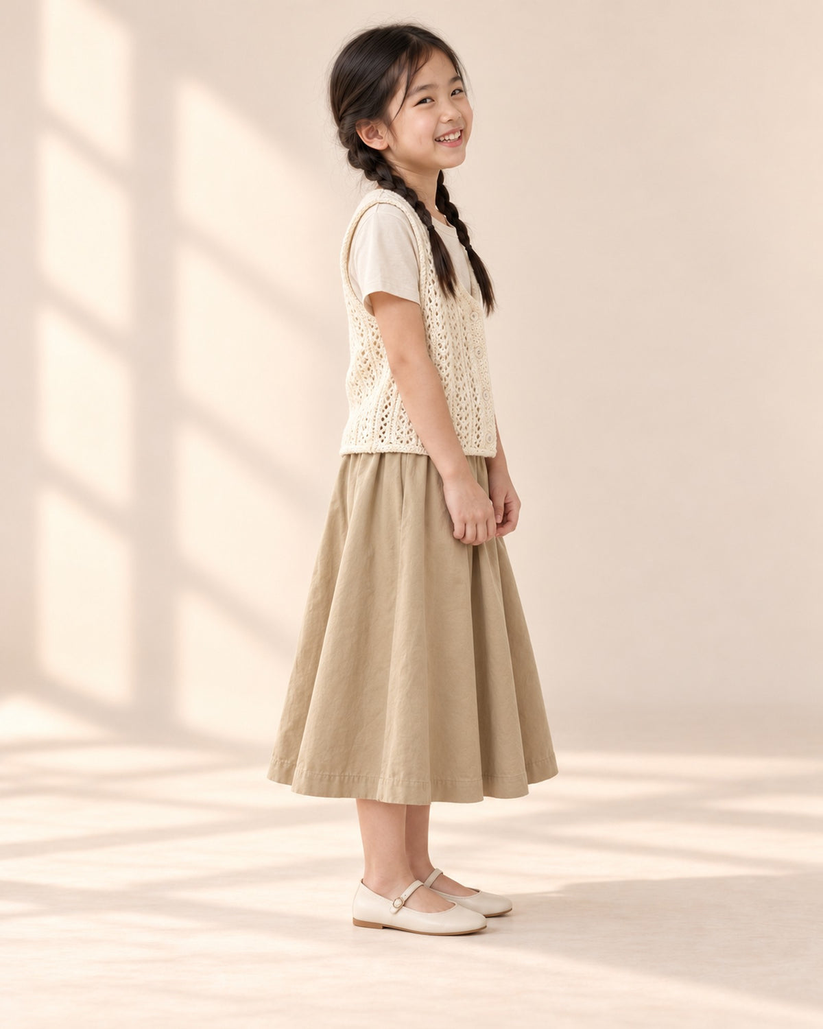 Side view of the cream open-knit vest – Cream