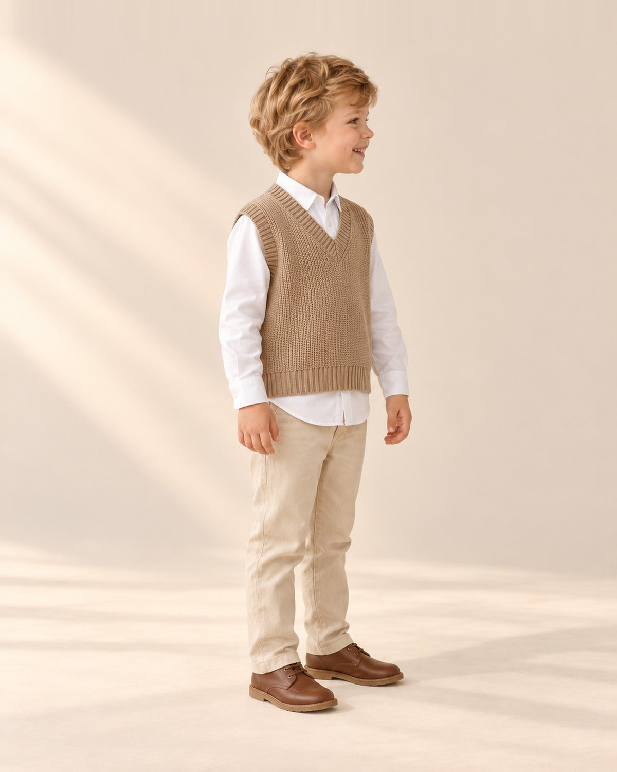Side view of the camel knit vest with the white shirt sleeve – Camel