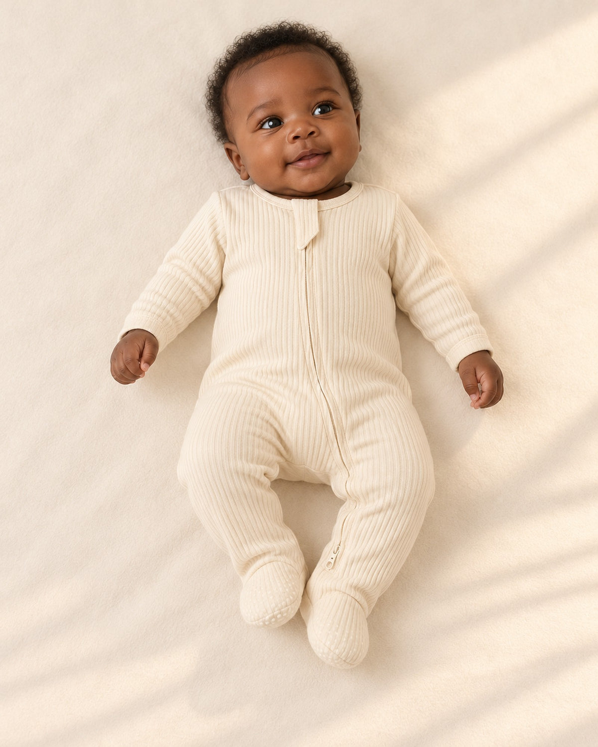 Cubby Ribbed Zip Footie in Cream – main