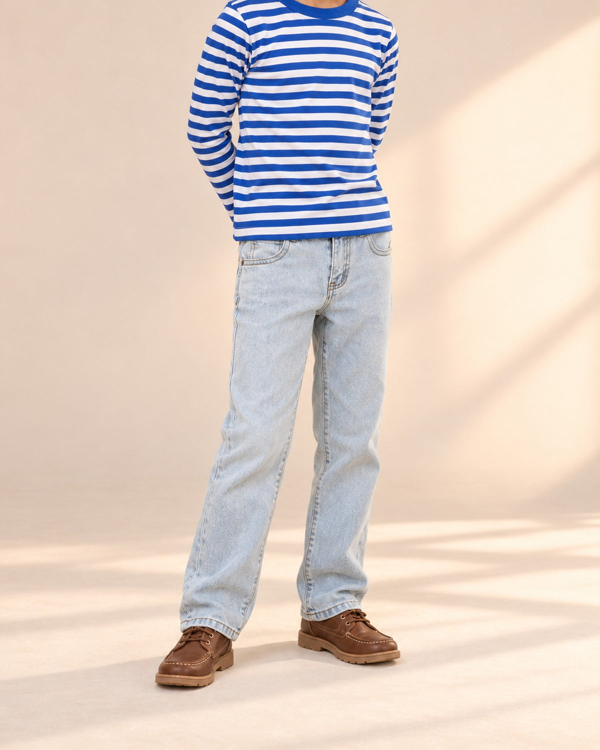 Close-up from chest to feet of light wash straight jeans with a metal button and five pockets – Light Wash