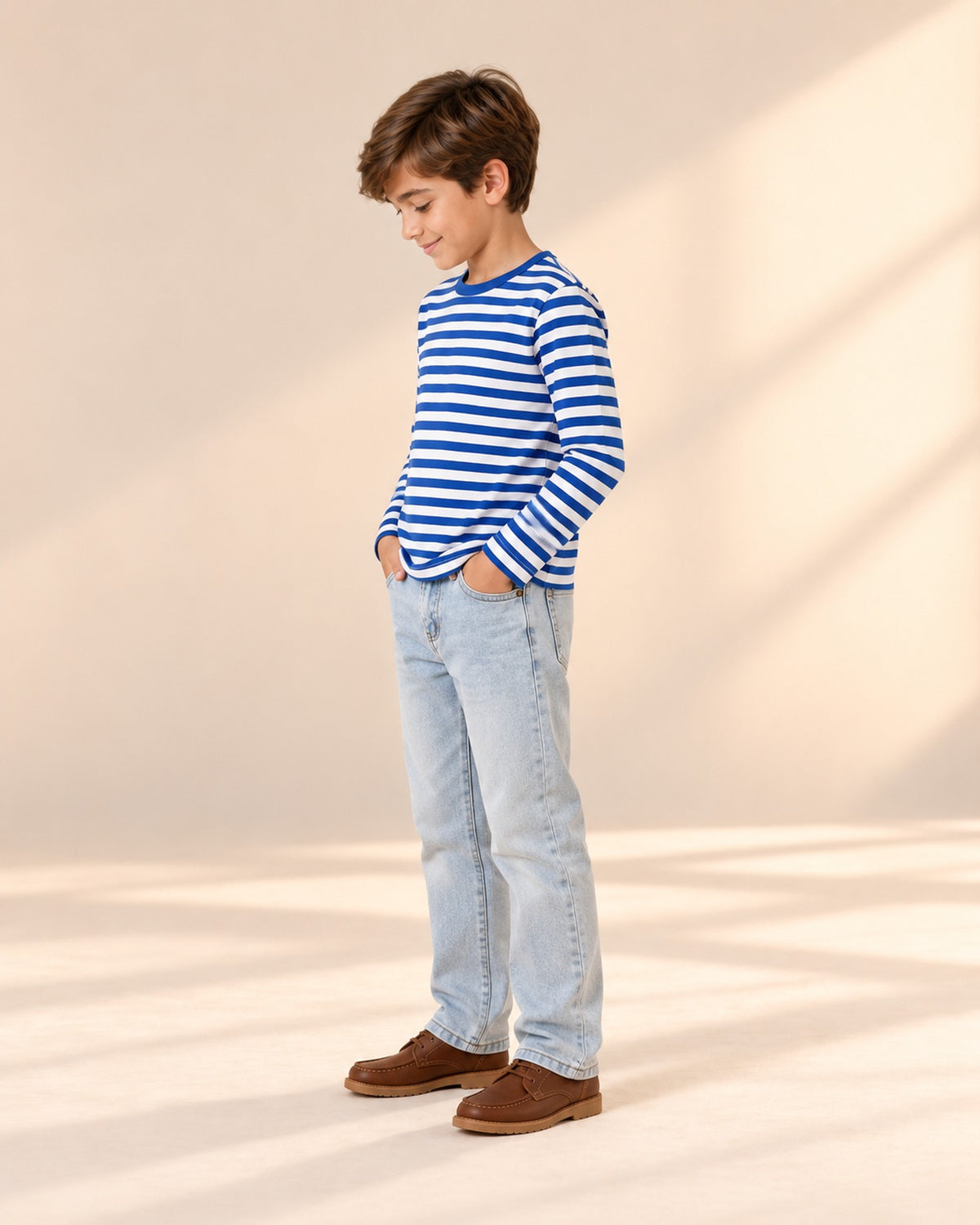 Side view of the straight jeans showing the full-length leg and pocket stitching – Light Wash