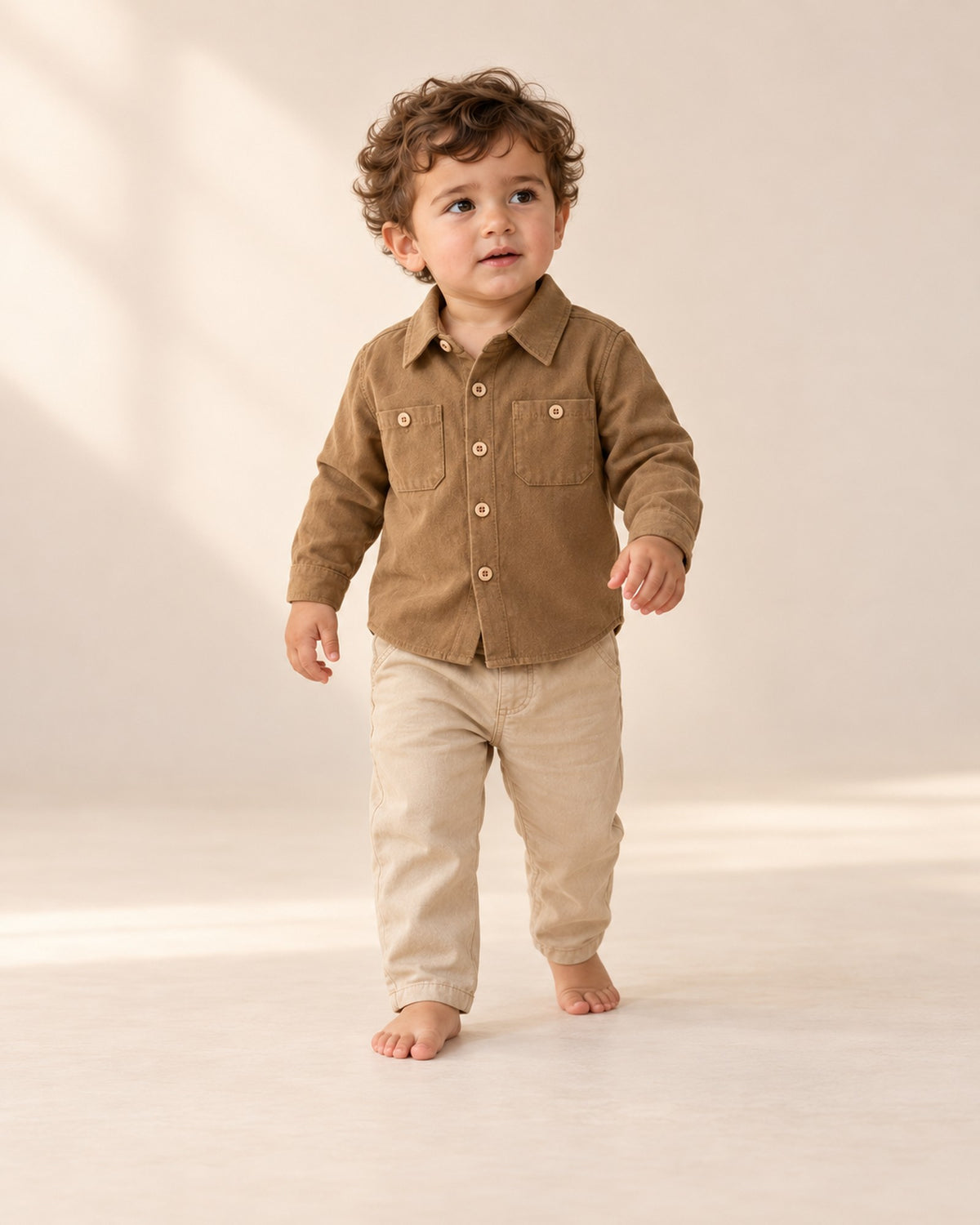 Toddler walking happily in khaki pull-on chinos and a camel shirt – Khaki