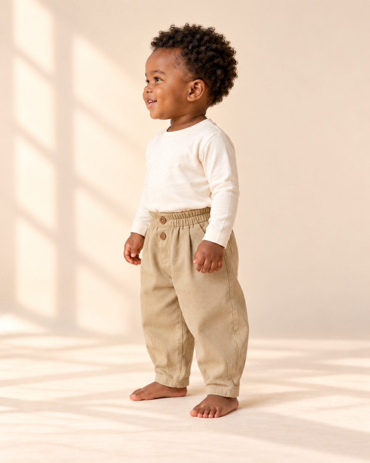 Side view of the balloon pants showing the roomy leg and tapered ankle – Khaki