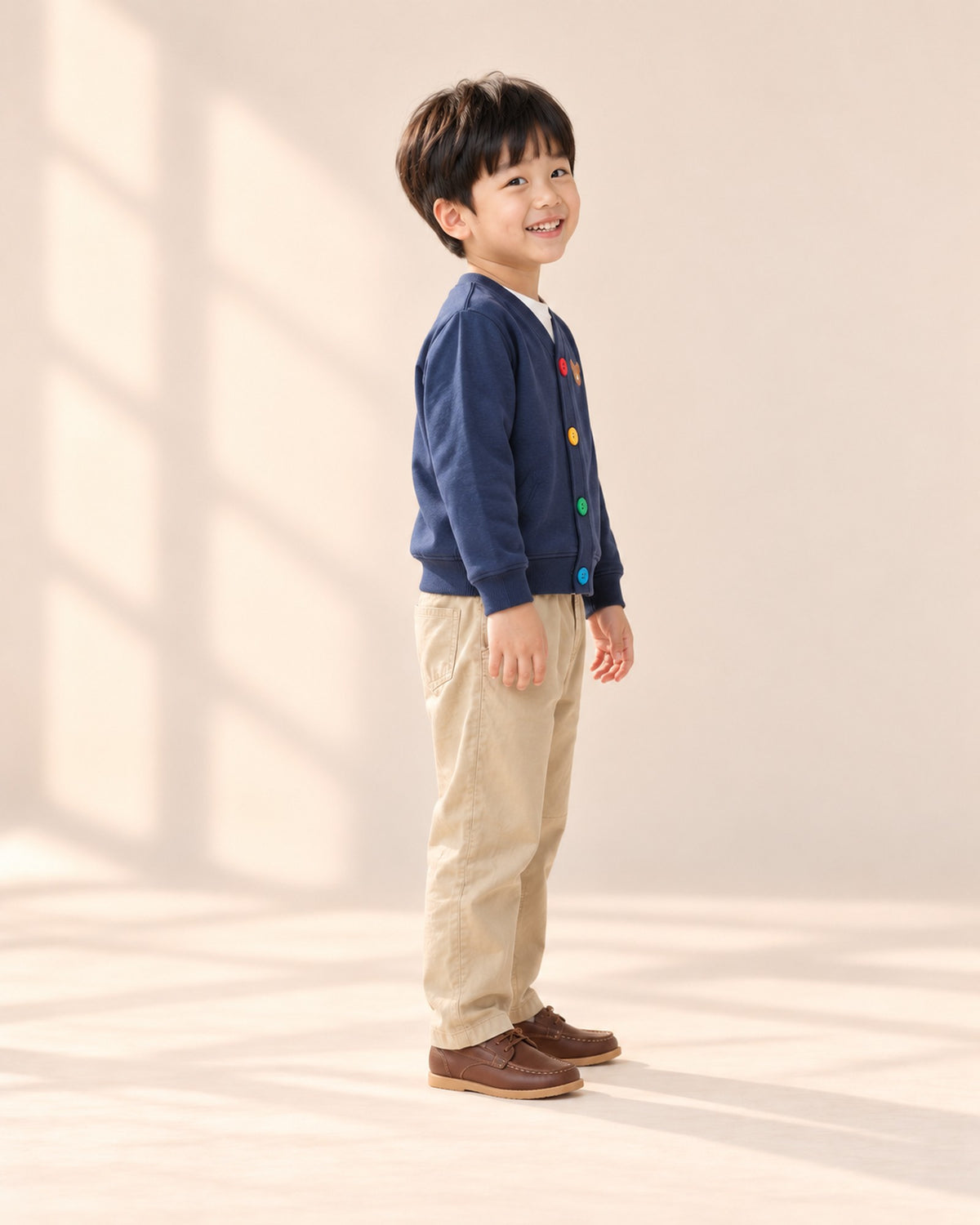 Side view of the khaki chinos showing the panel seams and tapered hem – Khaki