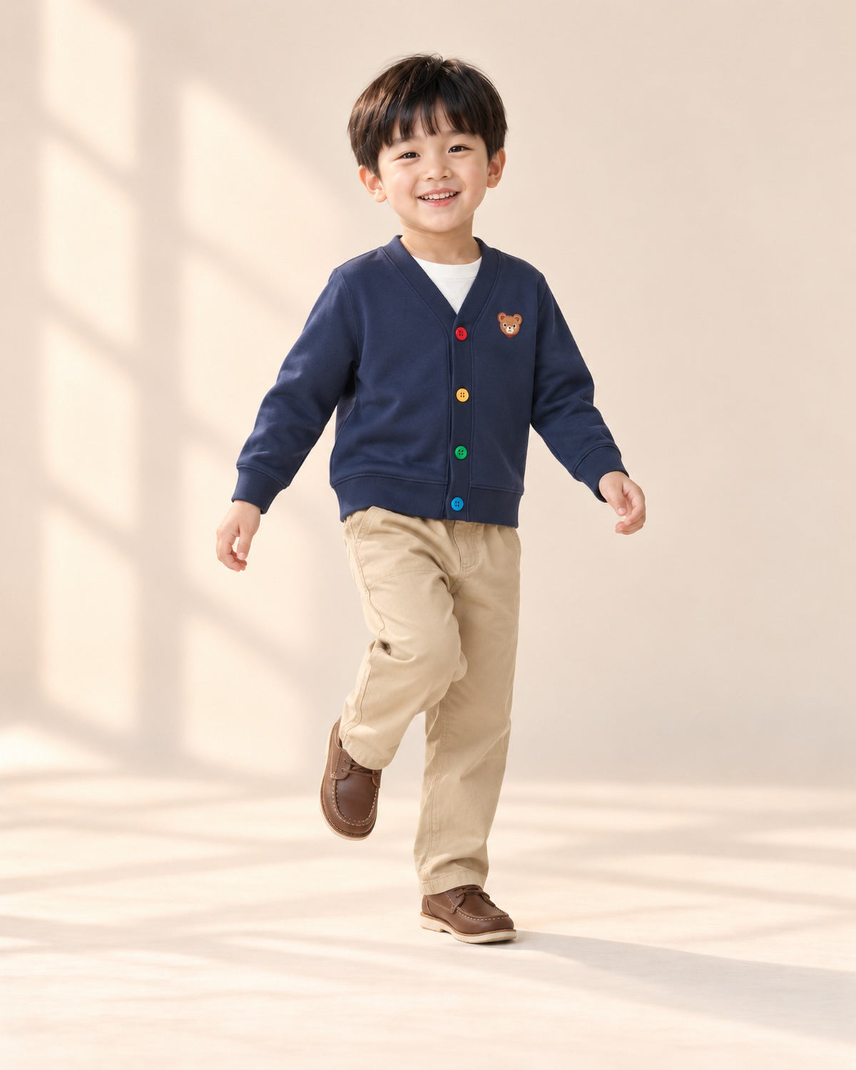 Boy sitting on a step in khaki everyday chinos – Khaki