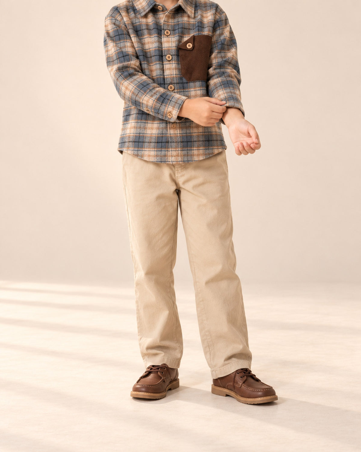 Close-up from chest to feet of straight-leg khaki chinos with an elastic waist – Khaki