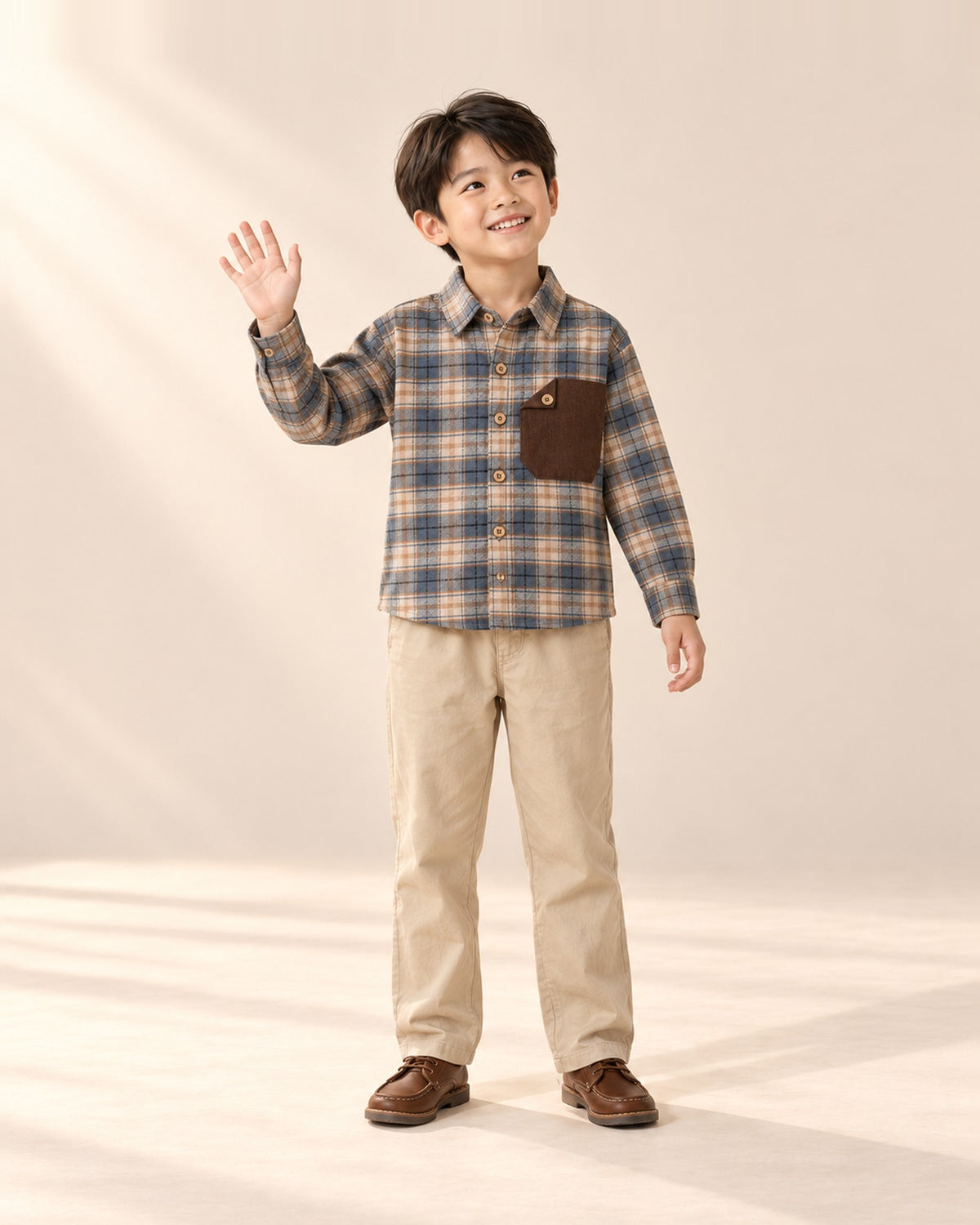 Front view of a boy in khaki chinos and a blue plaid flannel shirt – Khaki