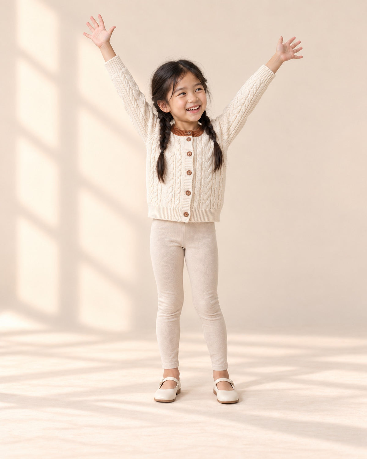 Girl in the oatmeal leggings and cable cardigan, standing relaxed – Oatmeal