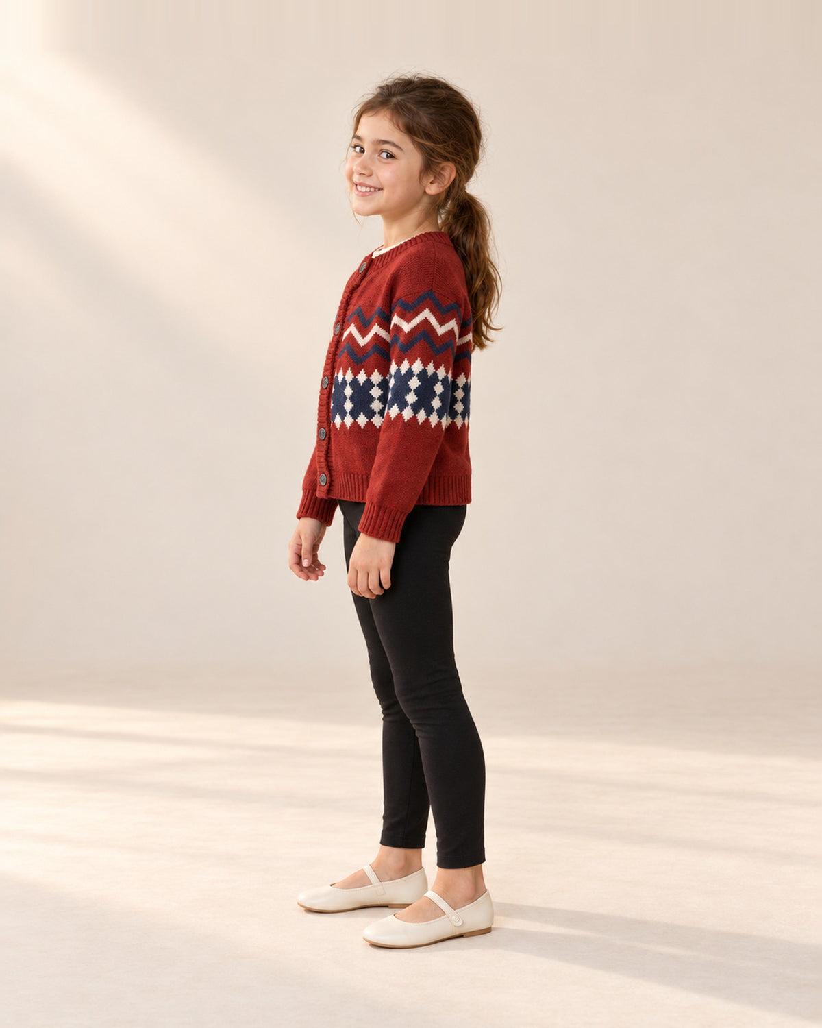 Side view of the black leggings with the red Fair Isle cardigan – Black