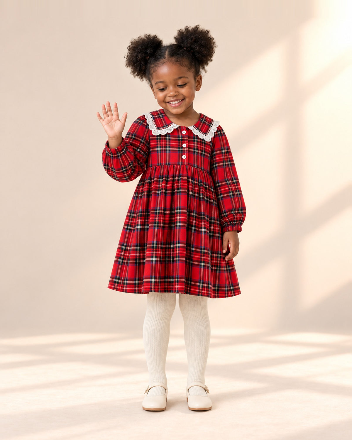 Front view of a girl in cream ribbed tights and a red tartan dress with a lace collar, full length – Cream