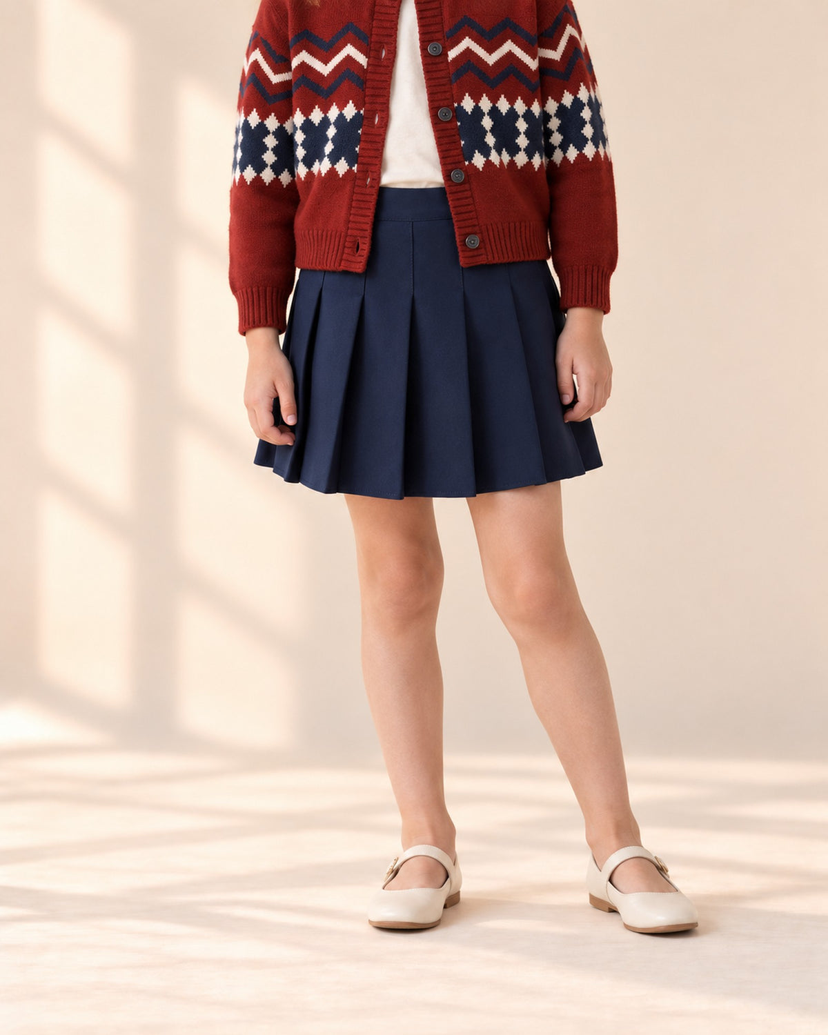 Close-up from waist to feet of a navy knife-pleated skirt – Navy