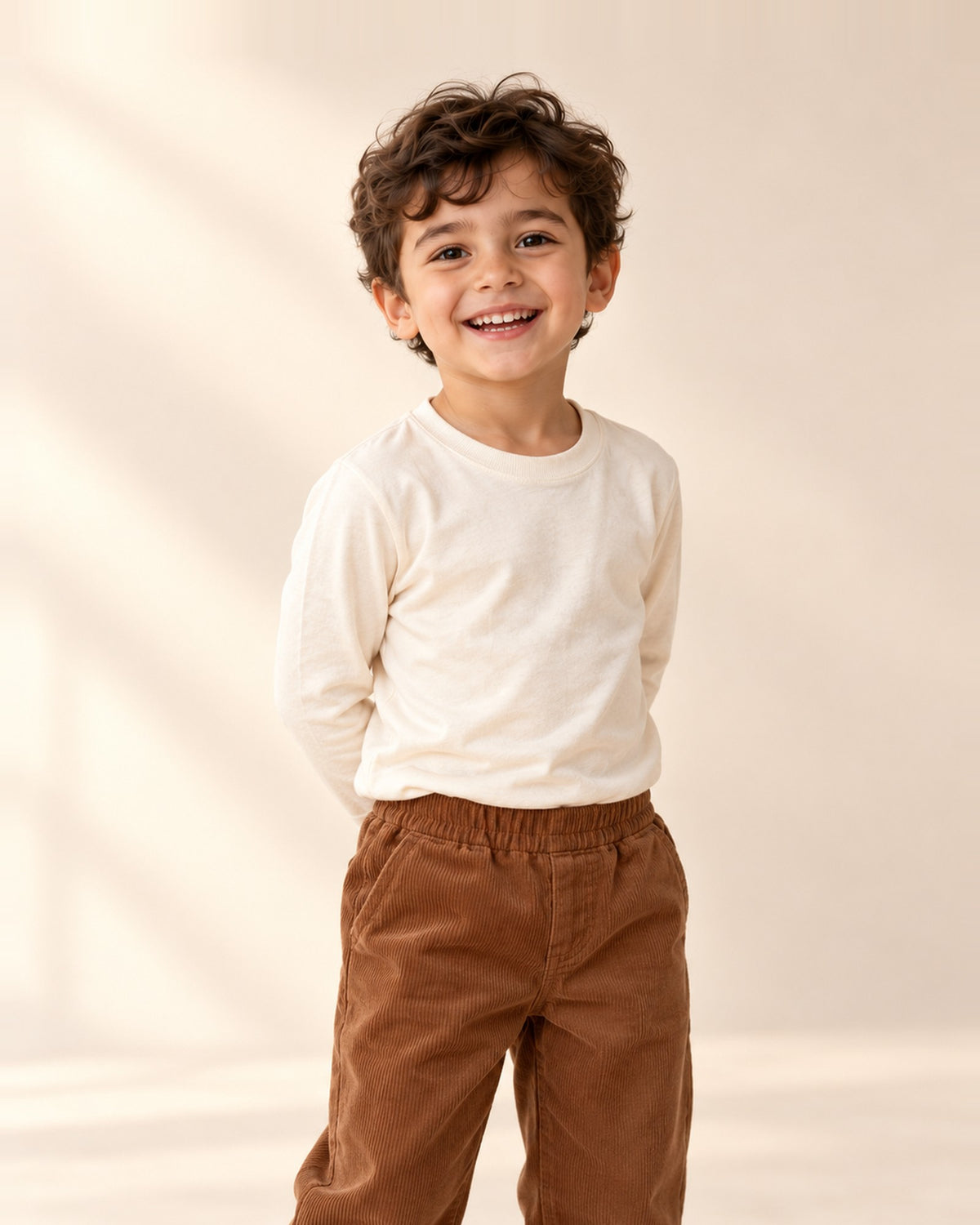 Close-up from head to hem of a cream crew-neck long sleeve tee – Cream