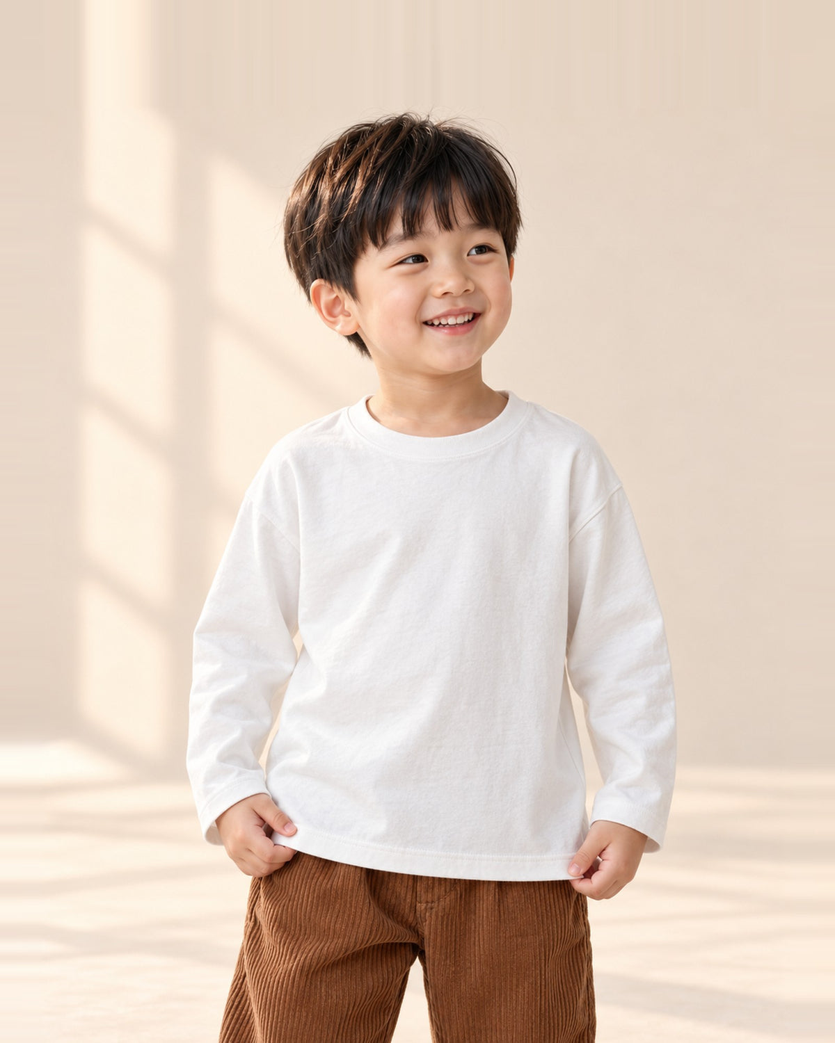 Close-up of the heavyweight white long-sleeve tee with a ribbed crew neck – White