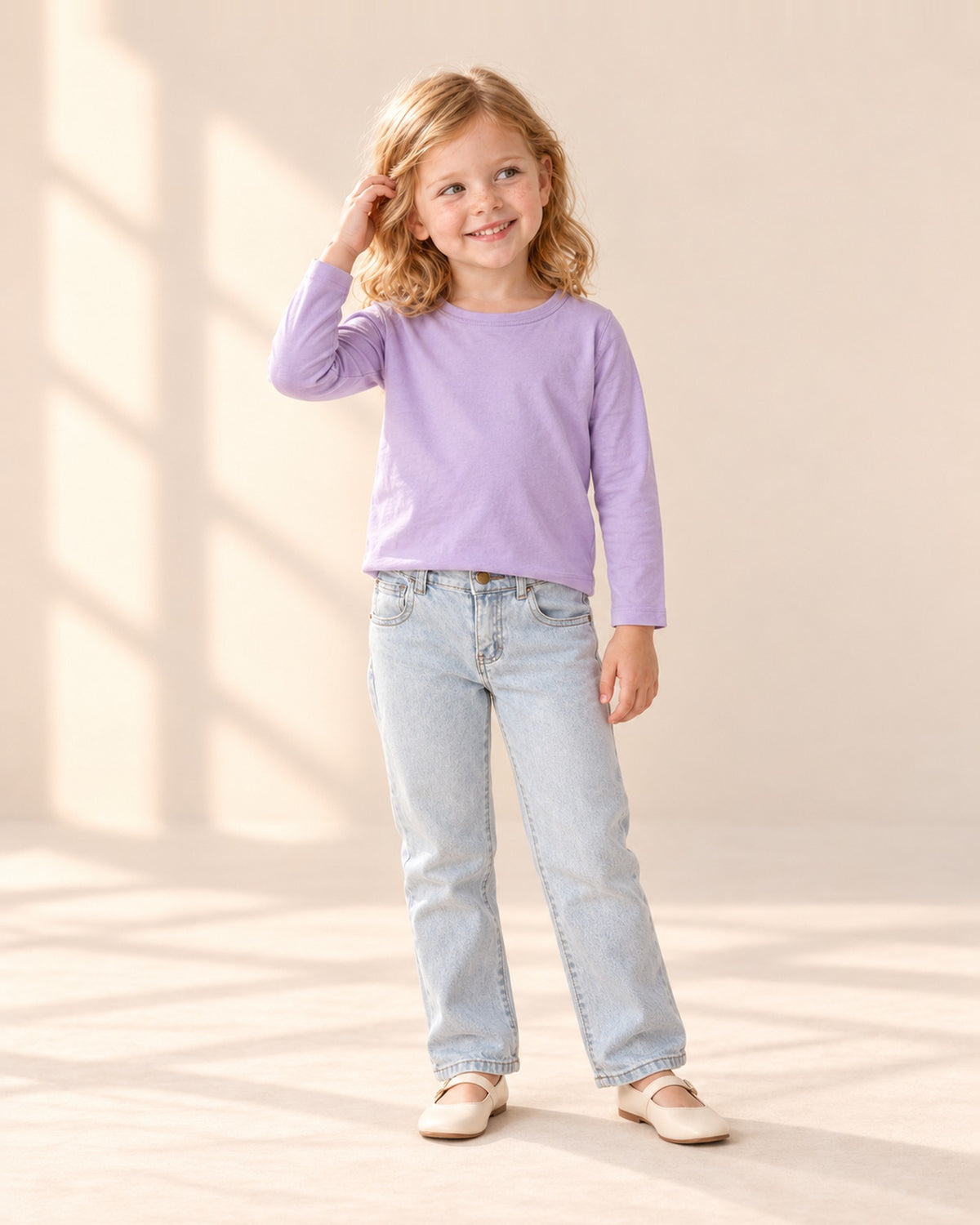 Front view of a girl in the lilac tee and light wash straight jeans, full length – Lilac